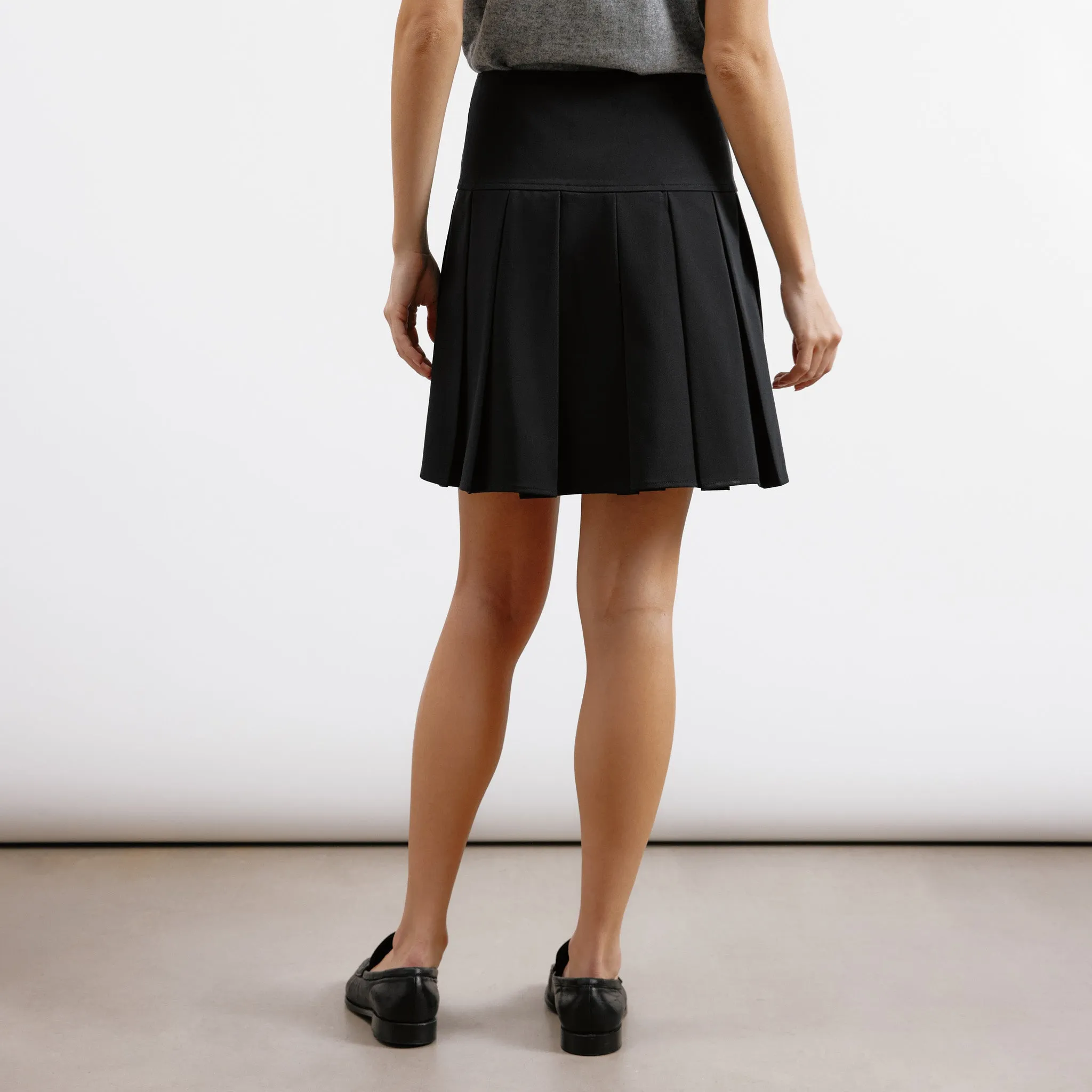 Black Tailored Pleat Mini Skirt by Albaray